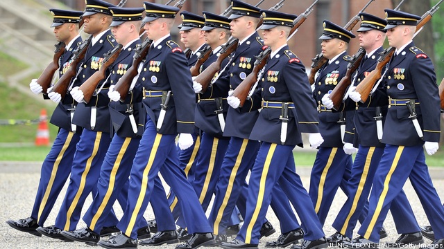 US soldiers march during a ceremony to c