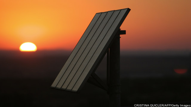 The sun sets on photovoltaic solar panel