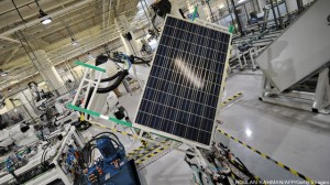 Robotic arm moves a solar panel at the R