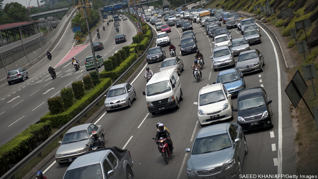 Mid-day traffic make its way through dow