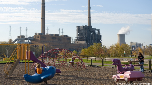 Children play in a playground in Racine,