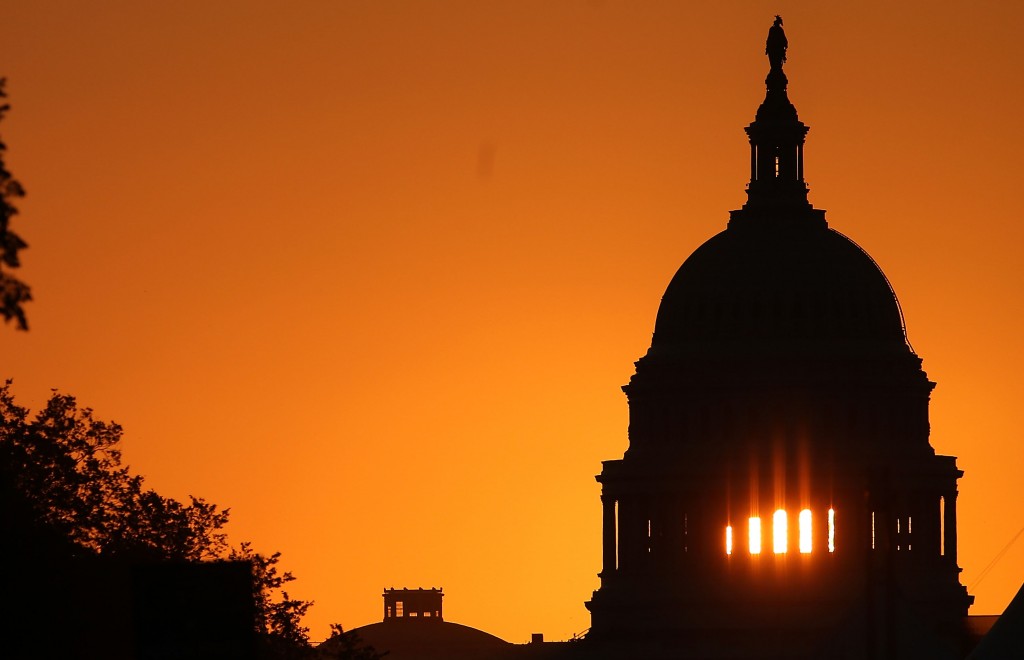 Sun Rises Behind U.S. Capitol Building
