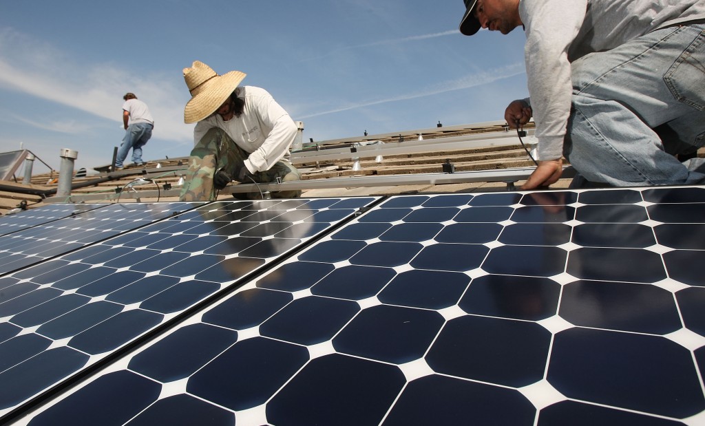 Work Crew Installs Solar Power Panels In Santa Monica