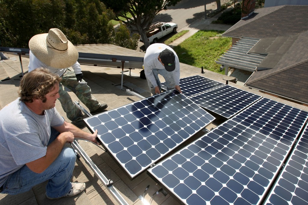 Work Crew Installs Solar Power Panels In Santa Monica