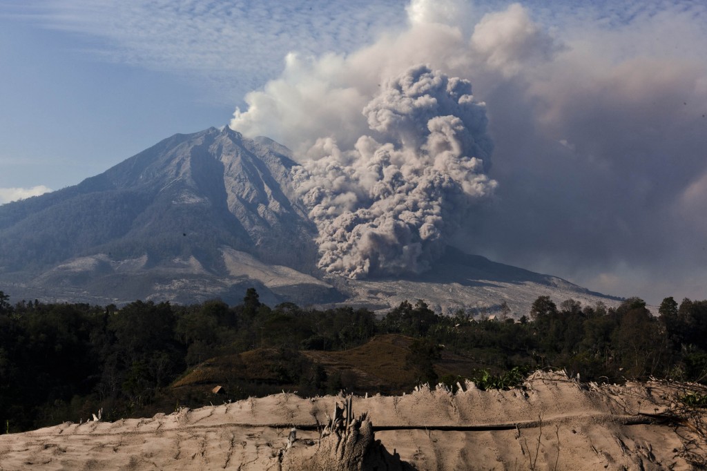 Mount Sinabung Continues To Erupt As People Return To Their Villages
