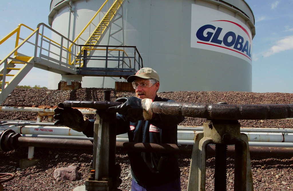 Distributor Offloads Oil From Barge