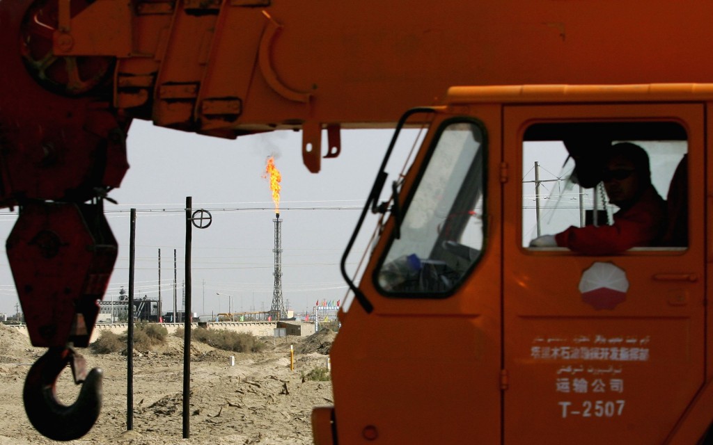 Chinese Labourers Work At Lunnan Oilfield In Xinjiang