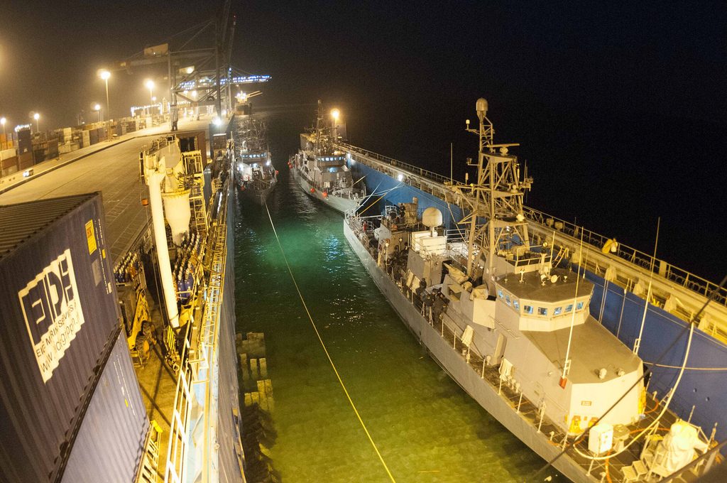 U.S. 5TH FLEET AREA OF RESPONSIBILITY (July 3, 2013) Patrol coastal ship (from left) USS Squall (PC 7), USS Thunderbolt (PC 12), and USS Tempest (PC 2) prepare to float off the motor transport vessel M/V Eide Transporter. The PCs’ arrival brings the total number to eight PCs here to support maritime security operations and theater security cooperation efforts in the U.S. 5th Fleet area of responsibility. (U.S. Navy photo by Mass Communication Specialist 2nd Class Danielle A. Brandt/Released) http://www.flickr.com/photos/navcent/9200781038/in/photostream/