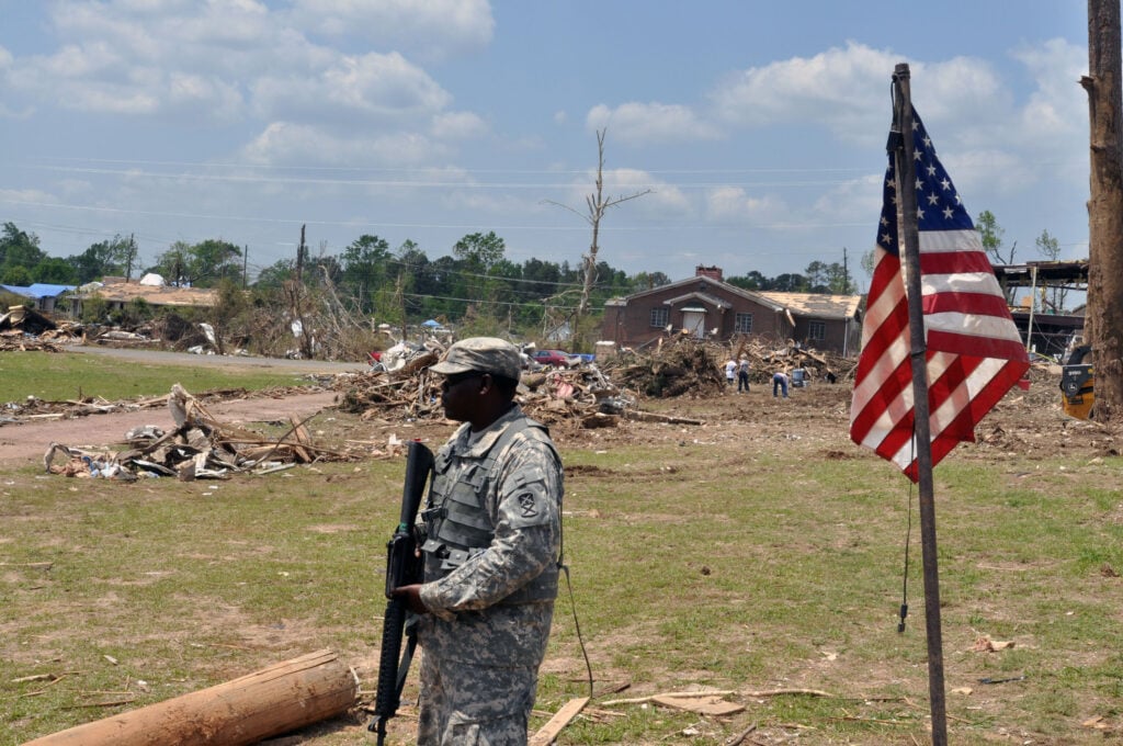 Army Pfc. Justin Jackson, of the Alabama Army National Guard's 1670th Transportation Company, provides flood response security for residents of Concord, Ala., May 9, 2011. Jackson is one of nearly 2,000 Guard members assisting with security, logistics, aviation and other support missions throughout Alabamaâ€™s affected regions. (Alabama National Guard photo) (Released) http://www.nationalguard.mil/news/archives/2011/05/051011-Alabama.aspx