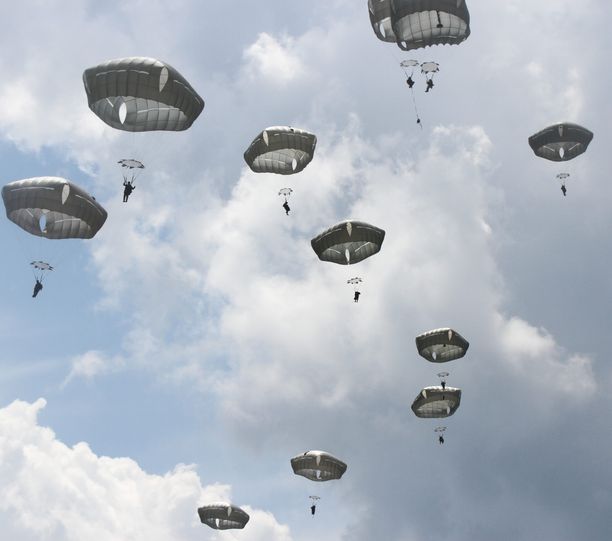 U.S. paratroopers utilizing T-11 parachutes conduct an airborne