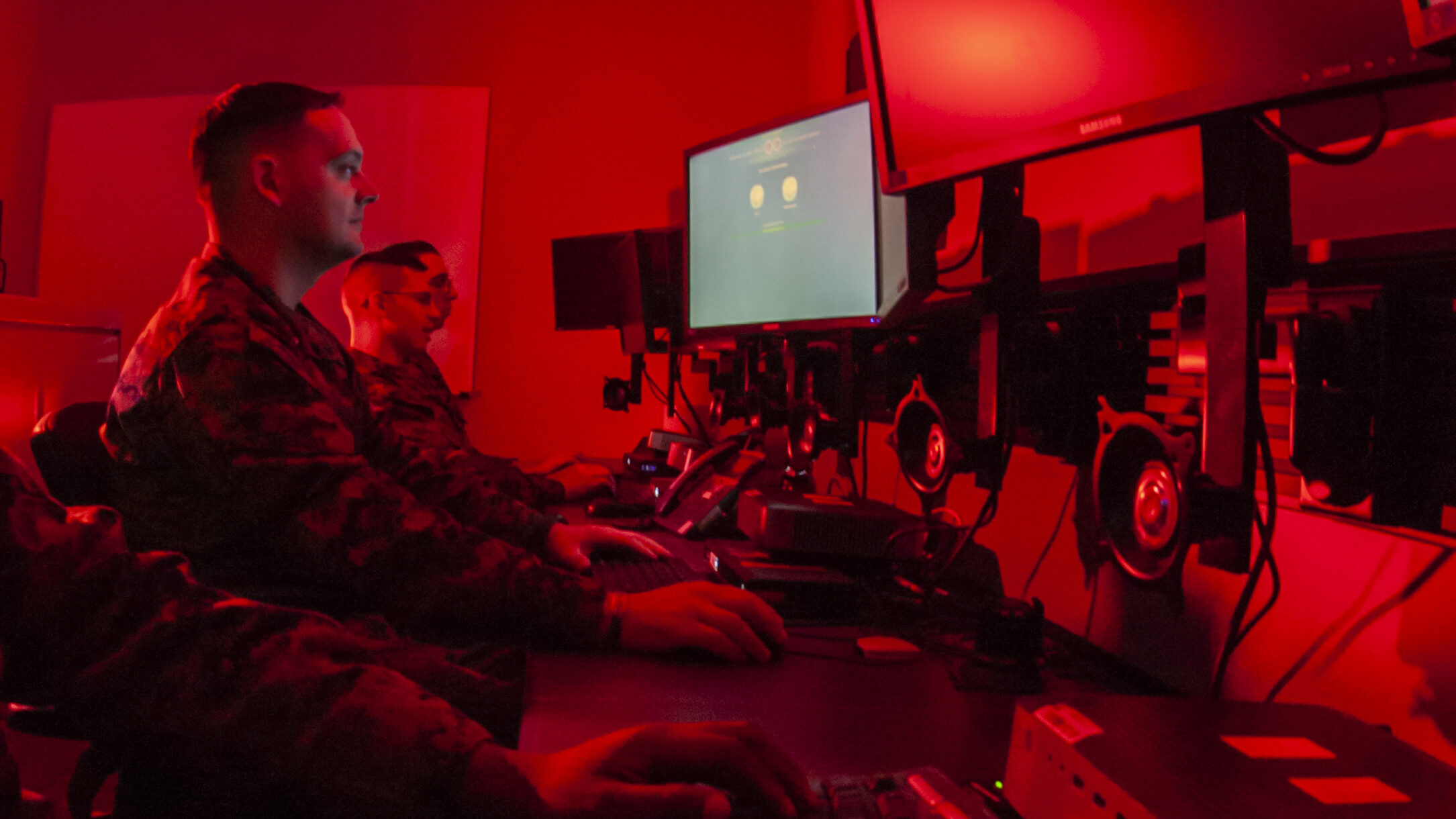 Marines with Marine Corps Forces Cyberspace Command pose for photos in cyber operations room at Lasswell Hall aboard Fort Meade, Maryland, Feb. 5, 2020. MARFORCYBER Marines conduct offensive and defensive cyber operations in support of United States Cyber Command and operate, secure and defend the Marine Corps Enterprise Network.