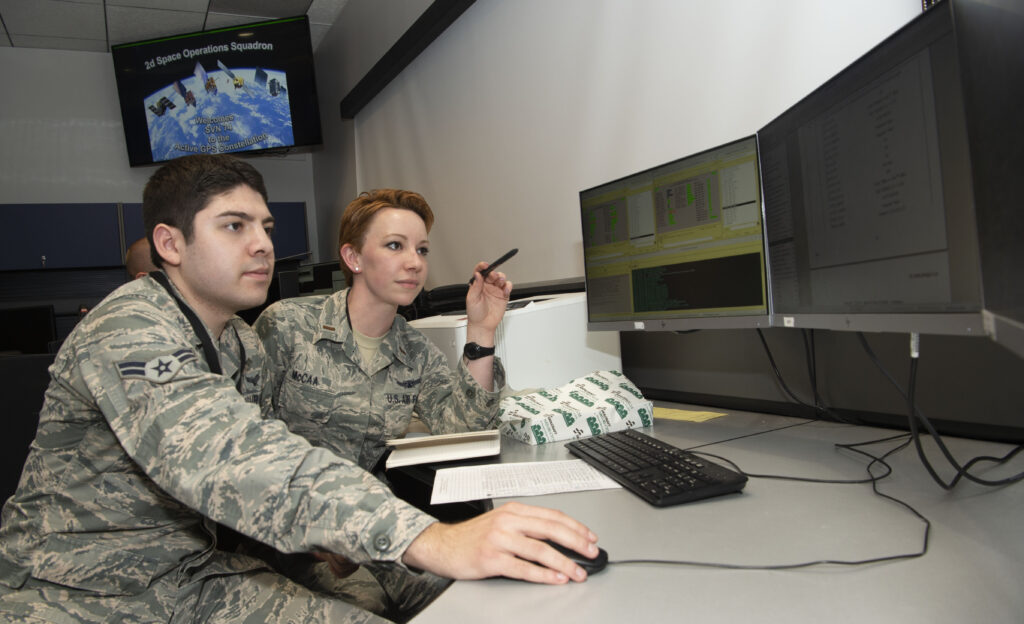 SCHRIEVER AIR FORCE BASE, Colo. – Second Lt. Kelley McCaa, 2nd Space Operations Squadron satellite vehicle operator, and Airman 1st Class John Garcia, 2nd SOPS satellite systems operator, set satellite vehicle number-74, the first iteration of GPS Block III vehicles, as healthy and active to users Jan. 13, 2020, Schriever Air Force Base, Colorado,. Setting the vehicle healthy and active makes the satellite available for use by military and civilian GPS users around the world for agriculture, banking and navigation. (U.S. Air Force photo by Staff Sgt. Matthew Coleman-Foster)