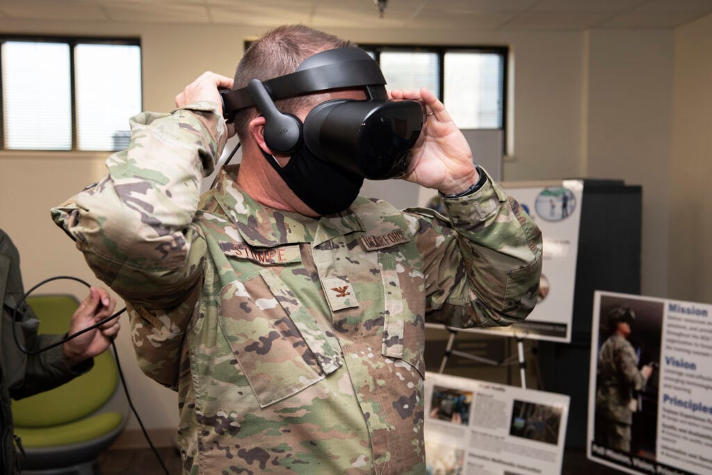 Col. Brian Stumpe, 2nd Air Force vice commander, puts on a virtual reality headset at Sheppard Air Force Base, Texas, Dec. 2, 2020. Stumpe is experiencing the "Fear of Heights" virtual reality simulator during his immersion tour at Sheppard. During his time at Sheppard, he visited several training squadrons and saw parts of their training processes. (U.S. Air Force photo by Senior Airman Pedro Tenorio)