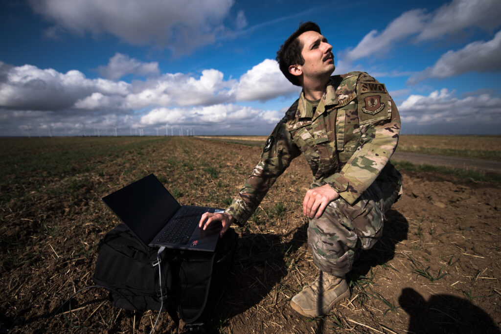 U.S. Air Force Staff Sgt. Casey Brija, 7th Weather Squadron weather forecaster, uses his instruments to measure cloud height, wind speed and wind direction at Alzey Dropzone, Flörsheim-Dalsheim, Germany, Sept. 30, 2020. Brija was responsible for collecting weather data to ensure Airmen could conduct airborne insertion operations. (U.S. Air Force photo by Staff Sgt. Devin Boyer)