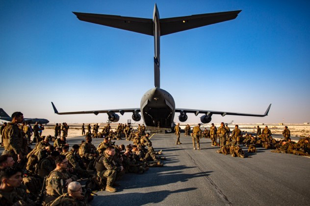 Evacuation at Hamid Karzai International AirportMarines assigned to the 24th Marine Expeditionary Unit (MEU) await a flight at Al Udeied Air Base, Qatar August 17. Marines are assisting the Department of State with an orderly drawdown of designated personnel in Afghanistan.