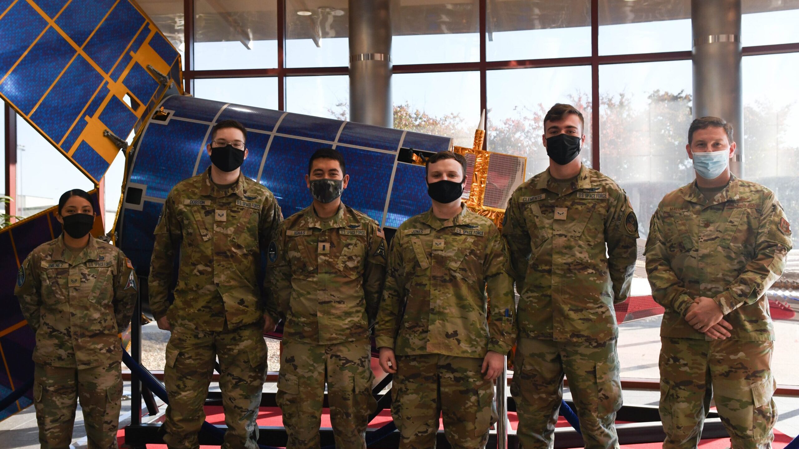 Members from the 2d Space Warning Squadron and 8 SWS pose for a photo in the lobby of the Mission Control Station on Buckley Space Force Base, Colo., Oct. 27, 2021. These members participated in the Coalition Virtual Flag exercise which focuses on Coalition Major Combat Operations in a realistic theater against a near-peer threat in a dynamic training environment. (U.S. Space Force photo by Senior Airman Haley N. Blevins)