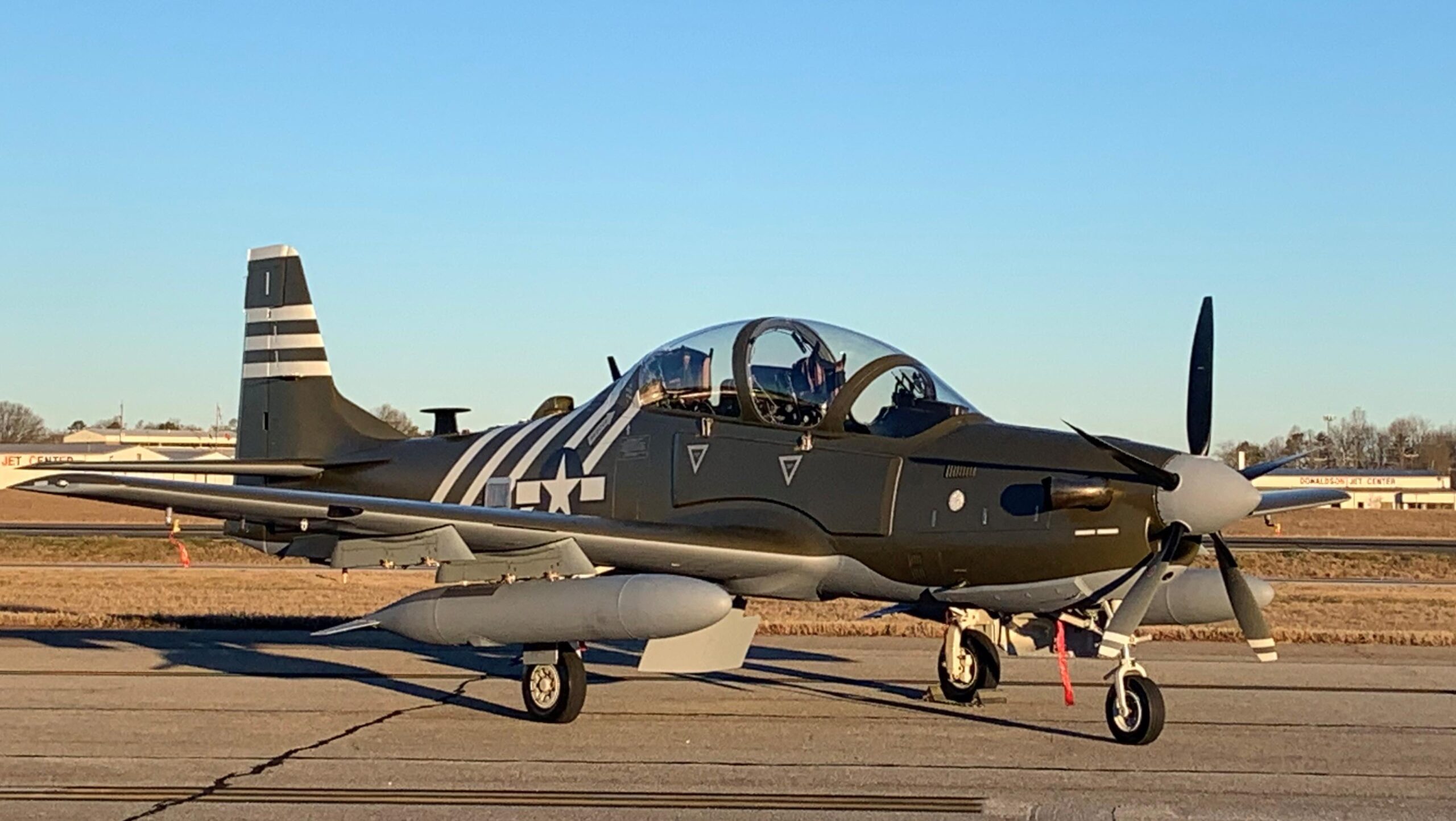 This A-29C Super Tucano is painted in the colors of the P-51 Mustang and P-47 Thunderbolt flown by Army Air Forces during World War II in China, Burma, and India.