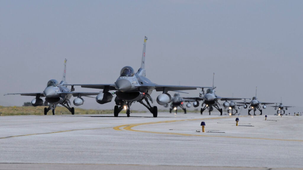 A squadron of Turkish Air Force F-16C and F-16D aircraft taxiing on the runway at Konya Air Base, Turkey.