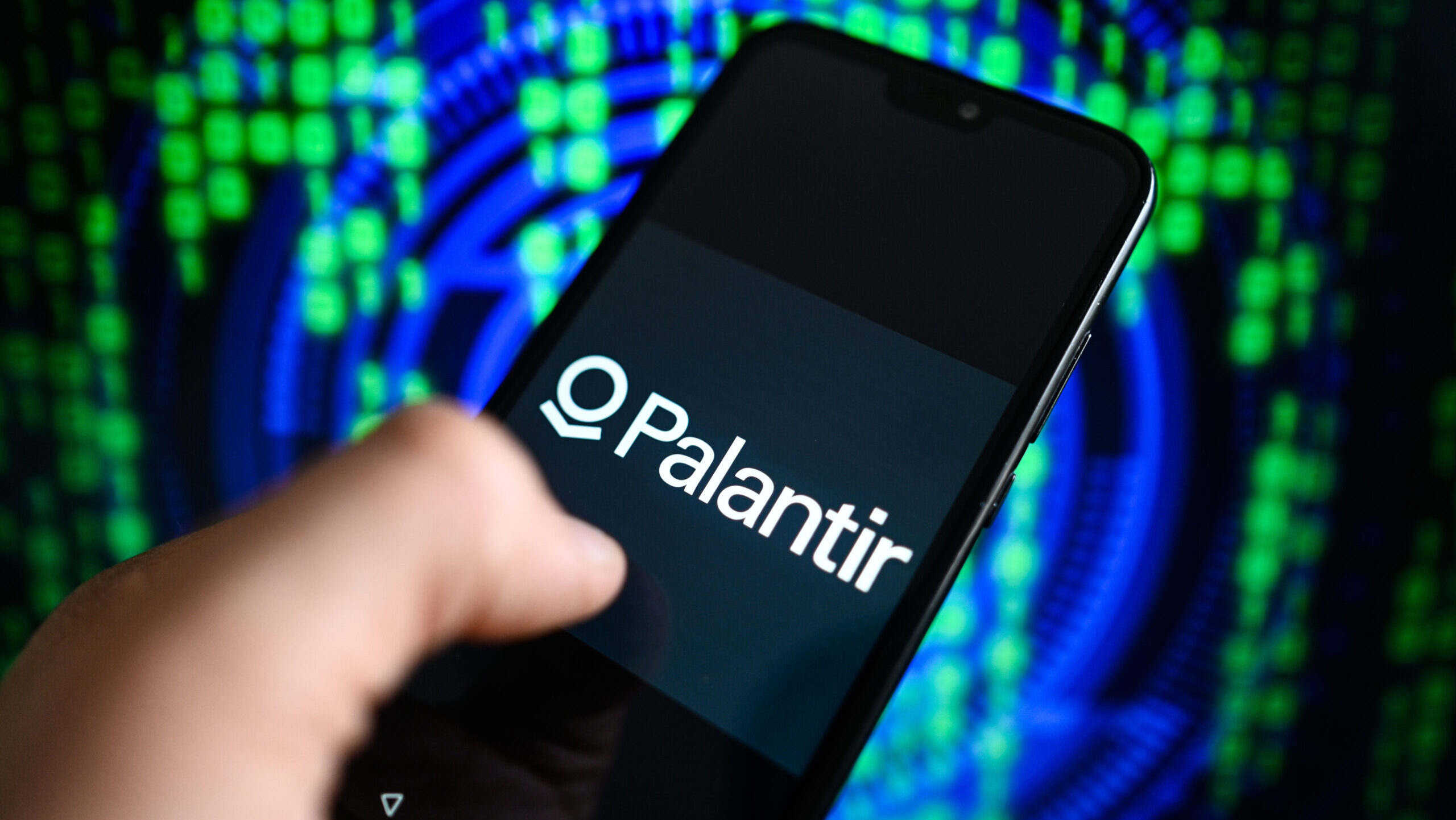 In this photo illustration the Palantir logo is displayed on